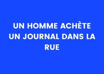 un homme achète un journal dans la rue