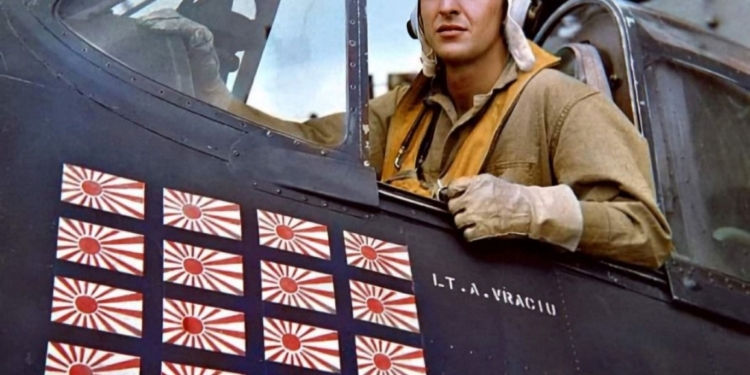 Navy Cross Recipient Alexander Vraciu, WWII Triple Ace, in cockpit of fighter plane.