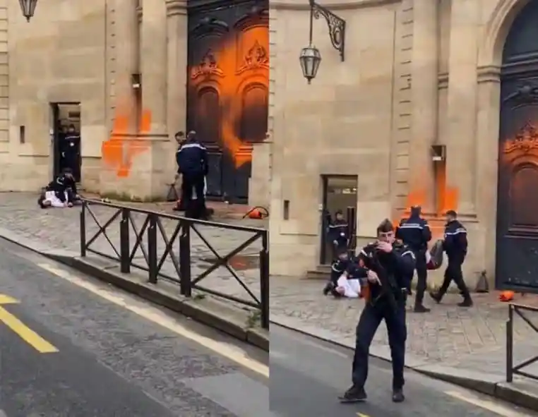 Des militants repeignent la façade de Matignon